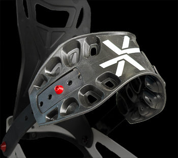 Close-up of black snowboard binding highback with white X logo