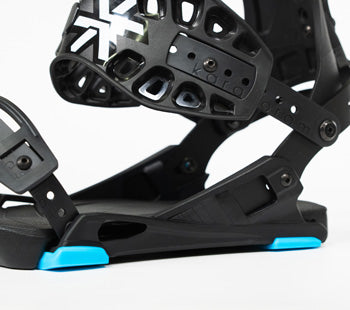 Black snowboard binding with blue highlights, close-up angled view