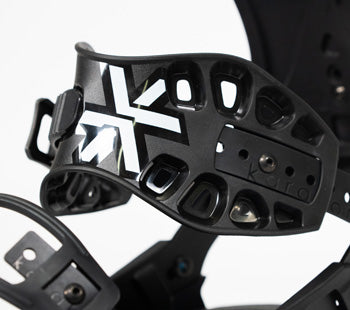 Close-up of black snowboard binding highback with perforated vent cutouts