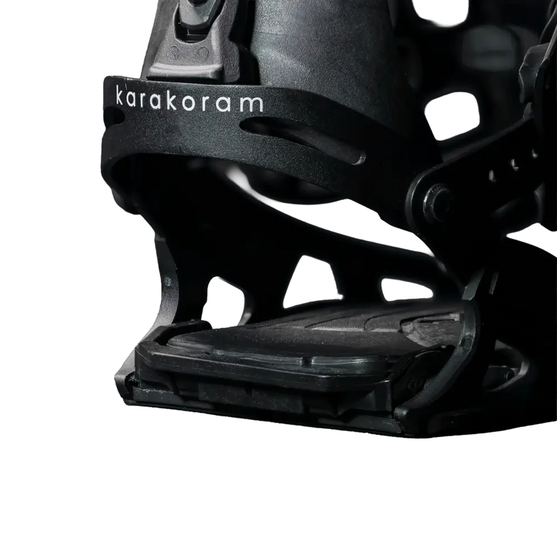 Close-up of black splitboard binding toe strap with Karakoram logo