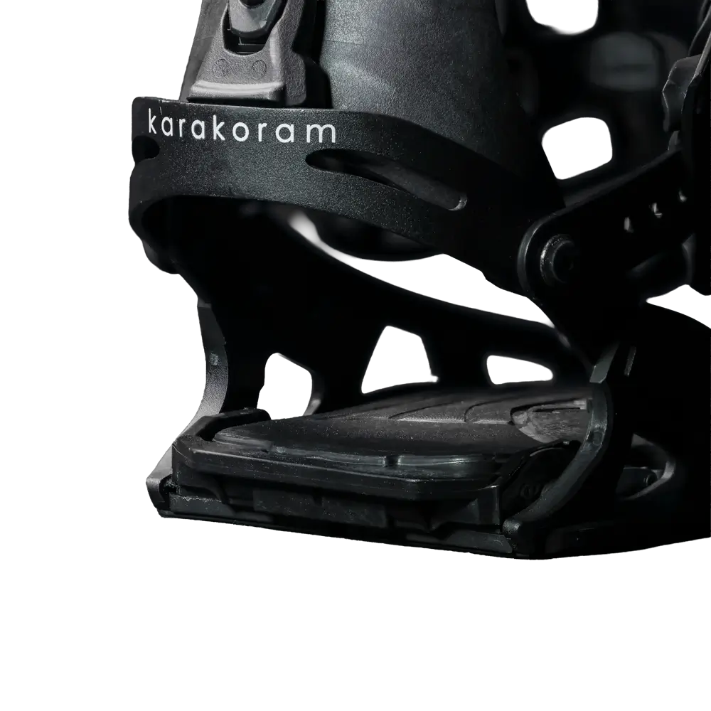 Close-up of black splitboard binding toe strap with Karakoram logo