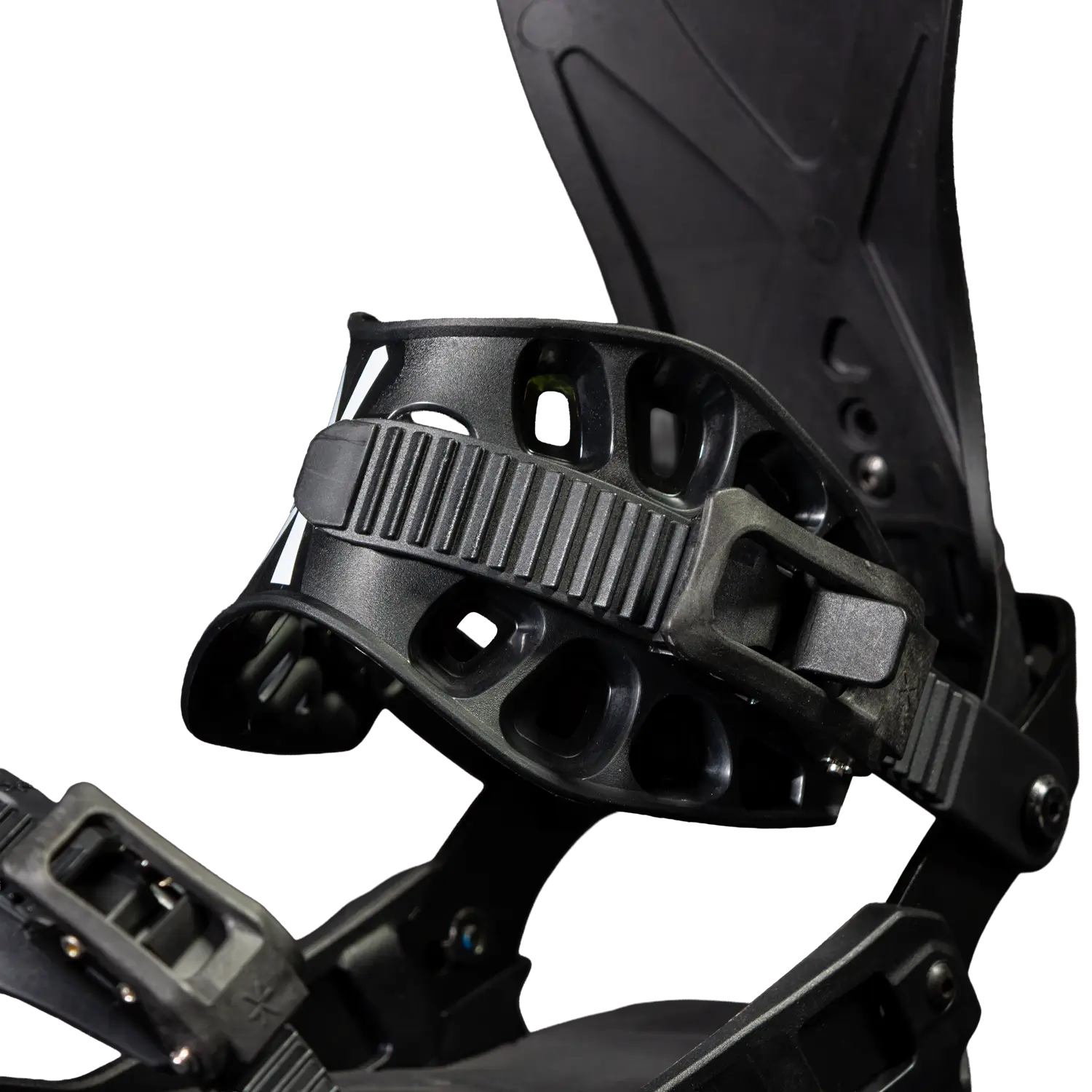 Close-up of black snowboard binding with ankle strap and highback