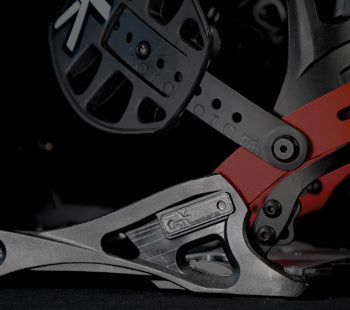Close-up of black and red ski touring binding mechanism on boot