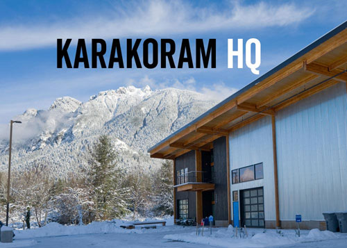 Karakoram HQ building with wood beams, snowy mountain backdrop
