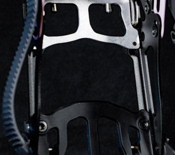 Close-up of compound bow riser and cam with black cables