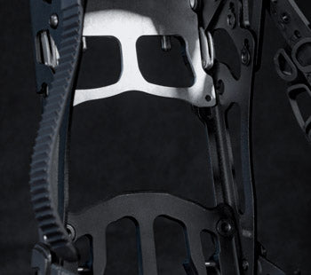 Close-up of black compound bow riser, cams, and cable system