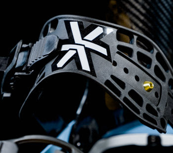 Close-up of black paintball mask strap with white logo