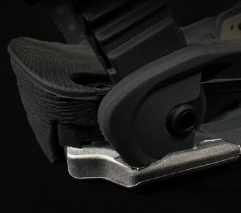 Close-up of black seat belt buckle mechanism with metal latch plate