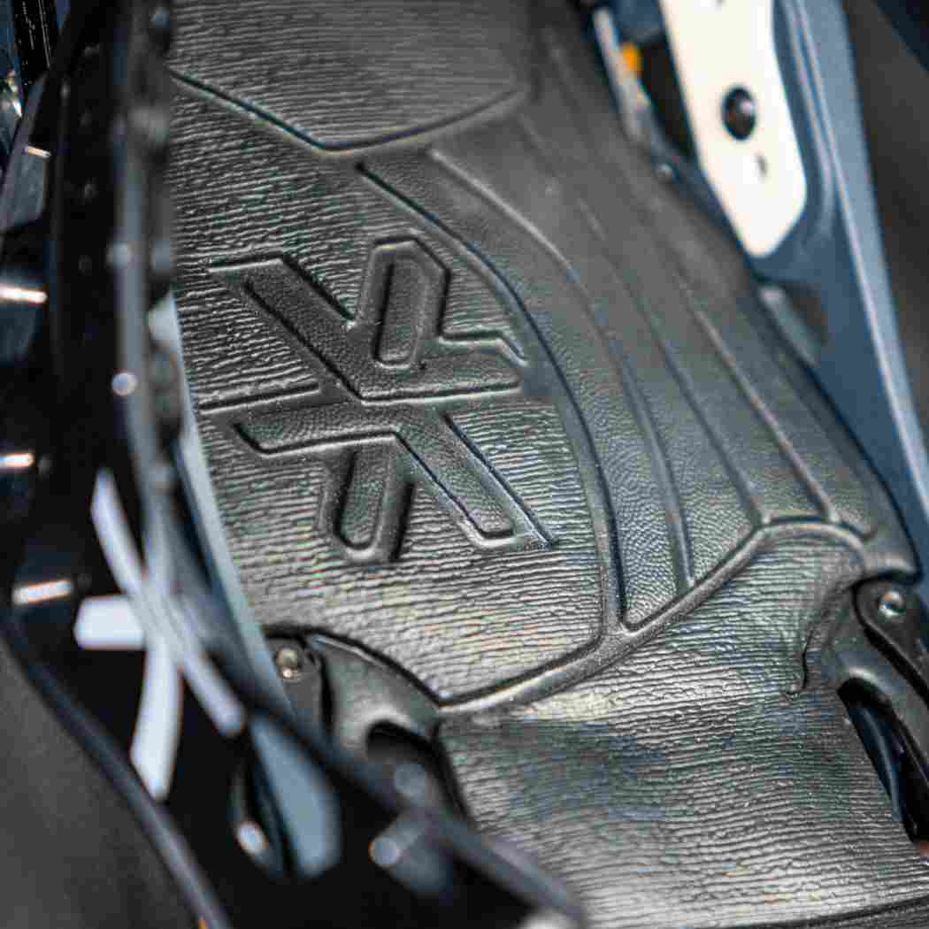 Close-up of textured black rubber sole on ski boot binding