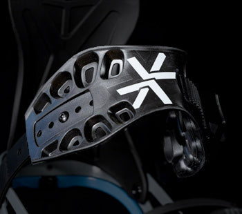 Black snowboard binding highback with cutout vents and white X logo