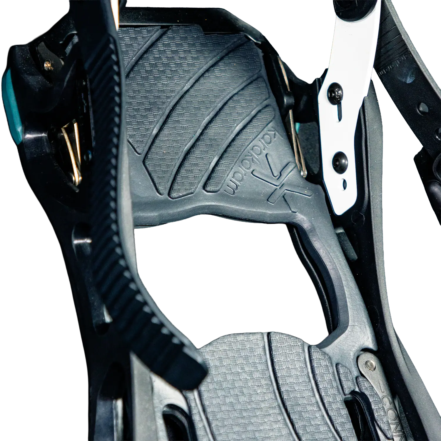 Close-up of black snowboard binding highback with textured footpad and straps
