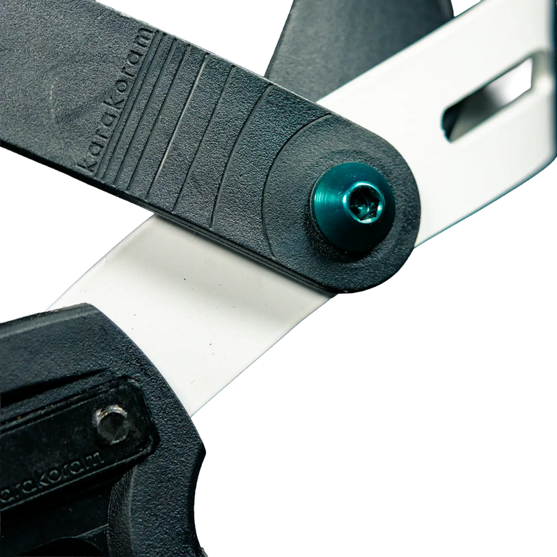 Close-up of black splitboard binding hinge with teal screw