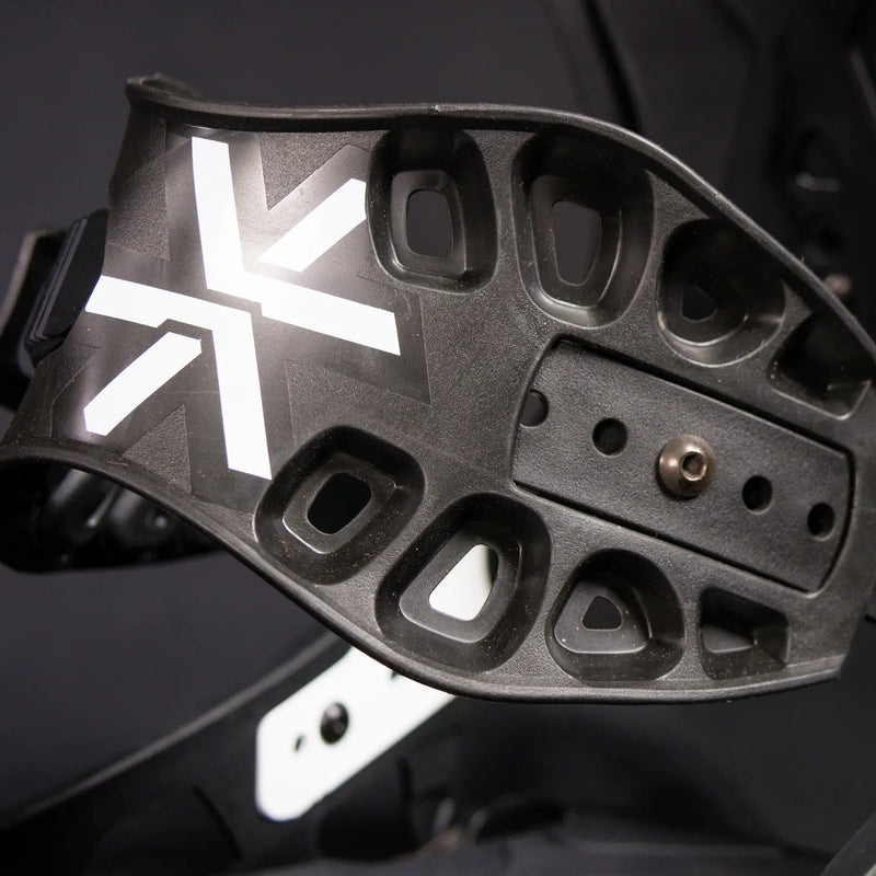 Close-up of black helmet's inner padding frame with white X logo