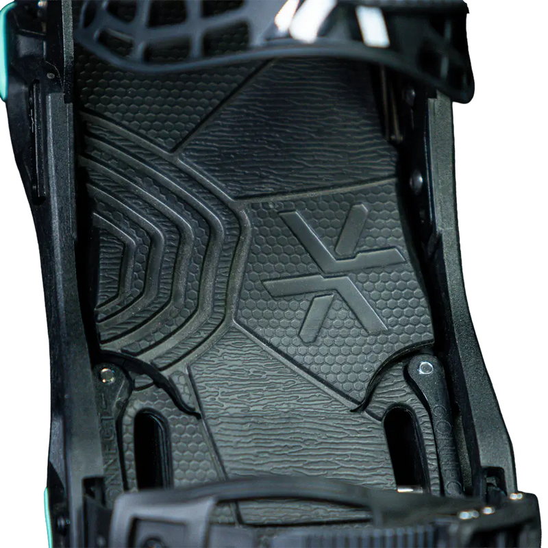 Close-up of black snowboard binding footbed with textured rubber pad