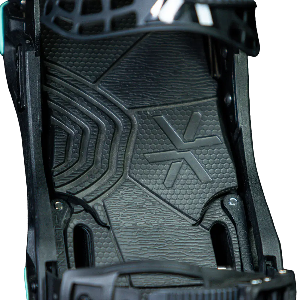 Close-up of black snowboard binding footbed with textured rubber pad