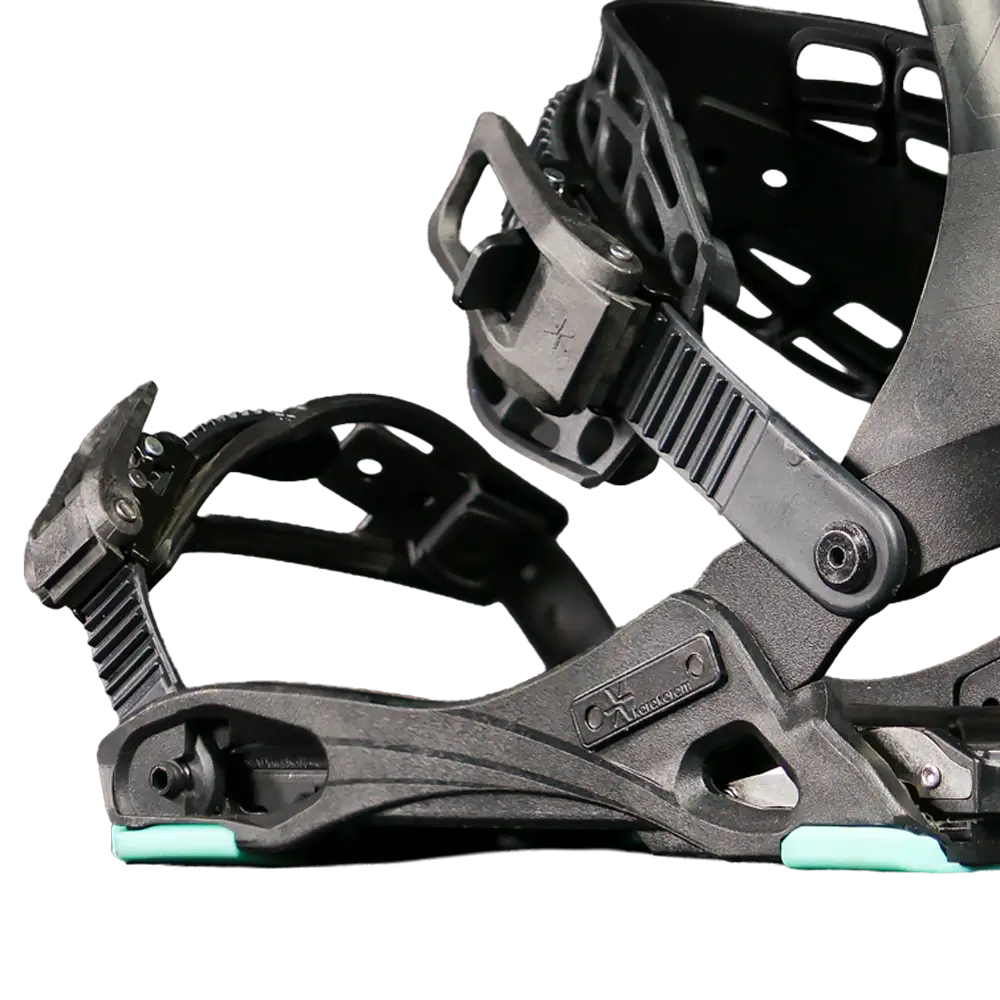 Close-up of black snowboard binding with mint green baseplate accents